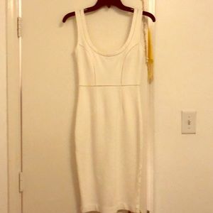 This is a tight fitted white mini dress